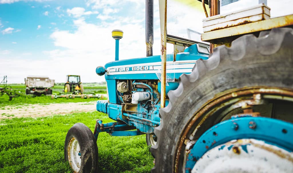 Blue Tractor in Field